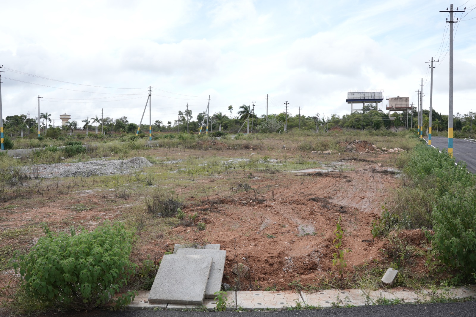 Dhanya's Aashraya residential plot road view Tallur Circle Mysore