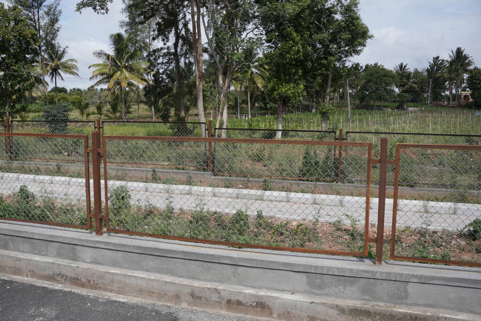 Dhanya's Aashraya asphalted internal road plots Mysore